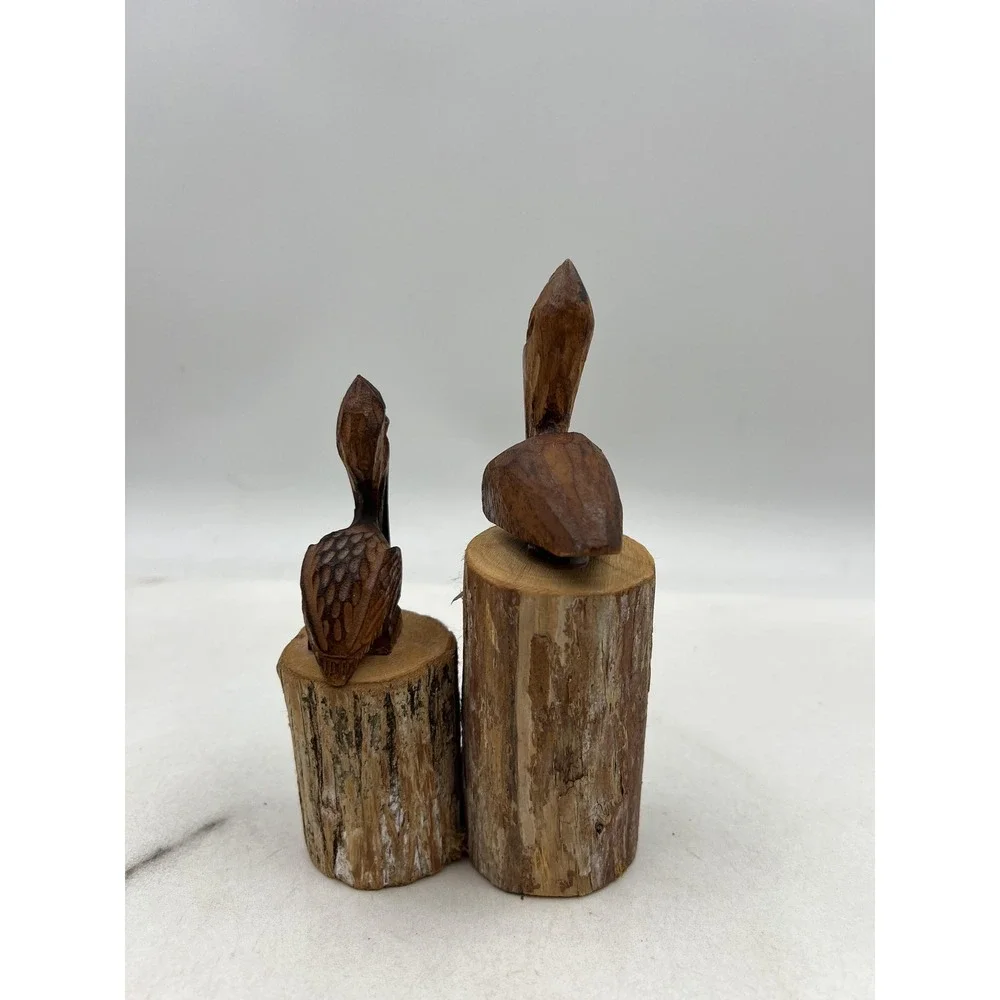 Hand Carved Wood Pelican Pair Figurines on Log Bases Rustic Coastal Folk Art